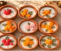 Terracotta bowl candles with rose and marigold wax flowers